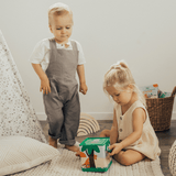 Toddlers playing with Mizzie the Kangaroo Musical Hop Out Box