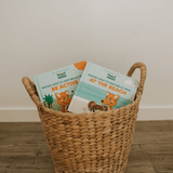 Decorative basket with Mizzie Touch and feel baby board books 'Be Active' and 'At The Beach'