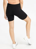 A woman in black maternity bike shorts, back (6535230947431)